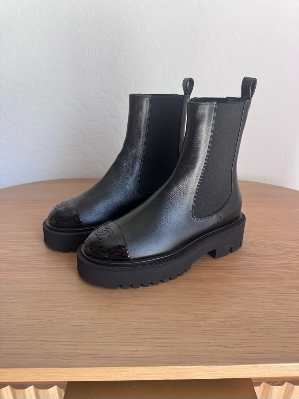 CHANEL Black Leather Chelsea Boots with Patent Cap Toe. New never worn.